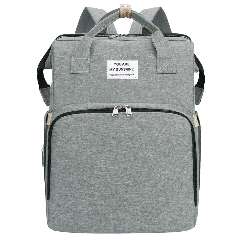 BabyCare – Mochila Multifuncional para Mamá y Bebé con Cuna Plegable y Red Antimosquitos