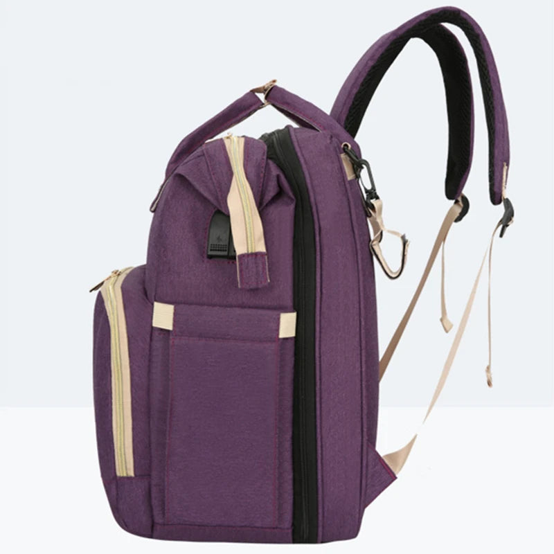 BabyCare – Mochila Multifuncional para Mamá y Bebé con Cuna Plegable y Red Antimosquitos